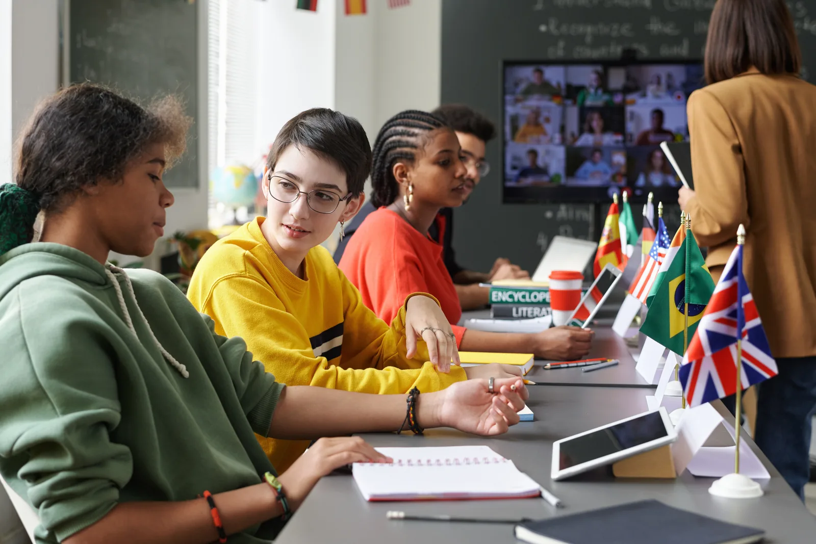 Secondary students taking part in a classroom language lesson