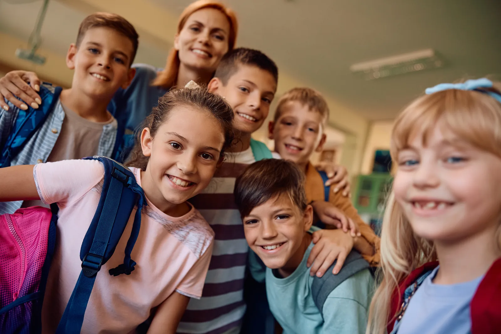 Students and a teacher together in a bright US classroom