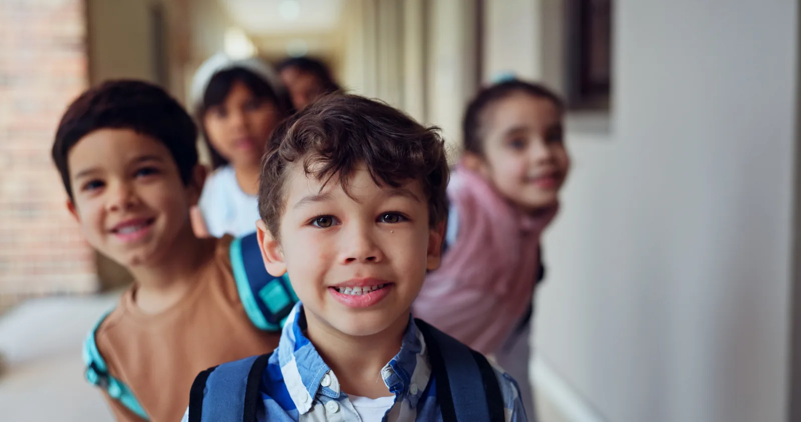 Students standing together in a school hallway